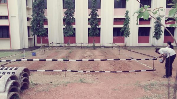 NSS volunteers make a fence for the Herbal Garden in College