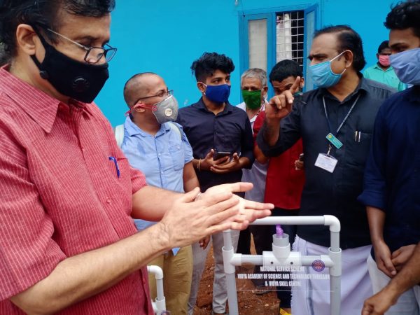 Edn Minister C Raveendranath hands over Vidya's Hands-free Sanitizer Dispenser to Puthukkad taluk Hospital