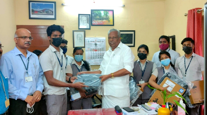 MLA A C Moideen distributes laptops to Vidya students